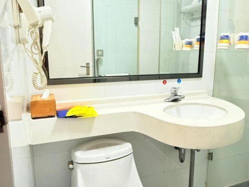 a bathroom with a sink and a toilet at 7 Days Premium·Xiamen Airport Xianglu in Xiamen