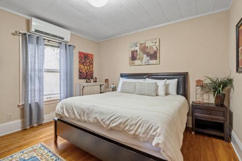 a bedroom with a large bed and a window at Uptown Urban Living in Minneapolis