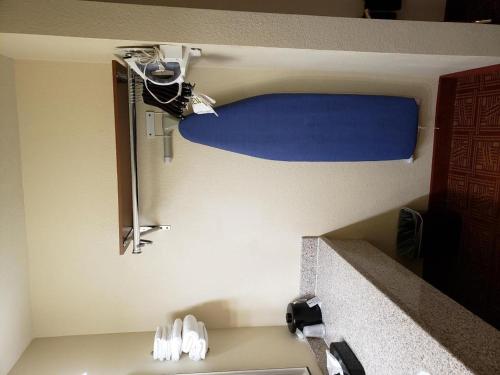 a bathroom with a sink and a mirror at Airport Inn in Boise