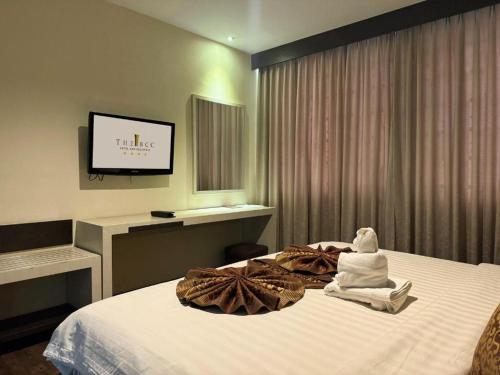 a hotel room with a bed with towels on it at The BCC Hotel & Residence in Nagoya
