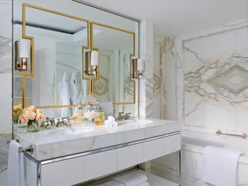 a bathroom with a sink and a mirror at The Langham Sydney in Sydney