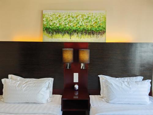 Katil atau katil-katil dalam bilik di Meetsuite at Ming Garden Residence