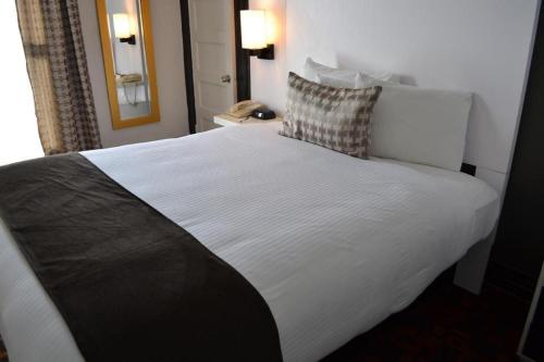 Кровать или кровати в номере Adante Hotel, a C-Two Hotel