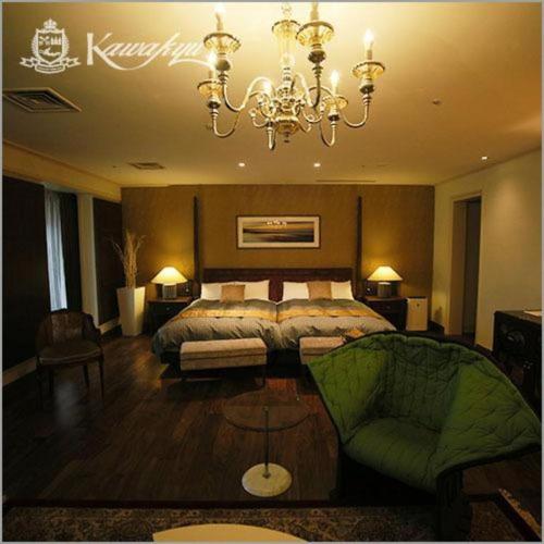Ένα ή περισσότερα κρεβάτια σε δωμάτιο στο Hotel Kawakyu