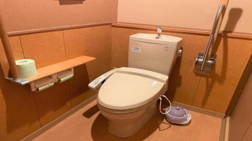 a bathroom with a white toilet in a stall at Hotel Miyama in Chichibu