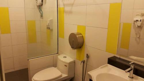 a bathroom with a toilet and a sink at Cukai View Hotel in Cukai