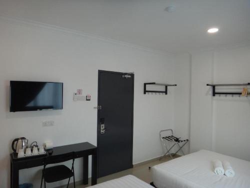 Katil atau katil-katil dalam bilik di Hotel Seri Geliga