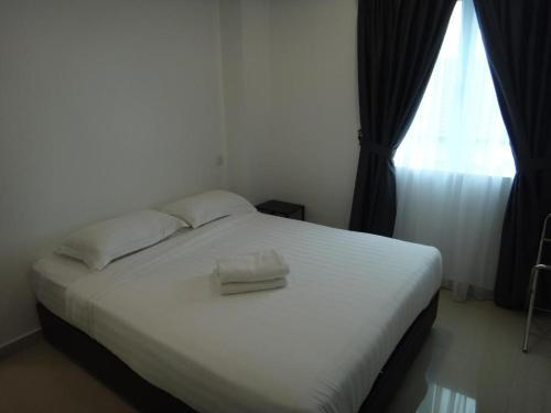 Katil atau katil-katil dalam bilik di Hotel Seri Geliga