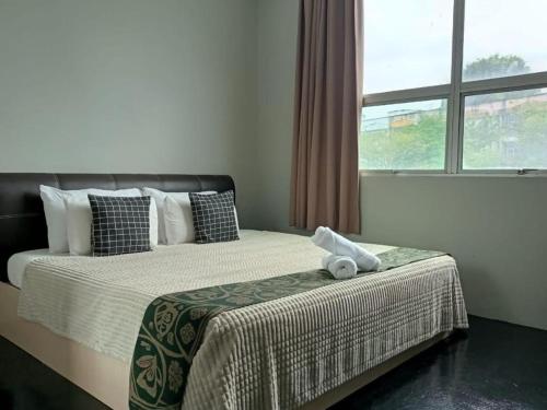 Ένα ή περισσότερα κρεβάτια σε δωμάτιο στο Oyasumi Hotel