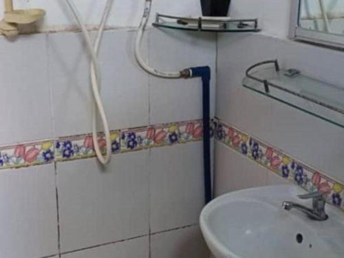 a bathroom with a sink and a shower at OYO 90785 Pandan Hotel in Kota Kinabalu