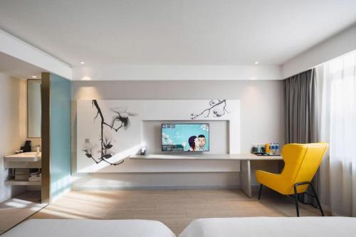 Ένα ή περισσότερα κρεβάτια σε δωμάτιο στο Magnotel Harbin Medical University First Affiliated Hospital