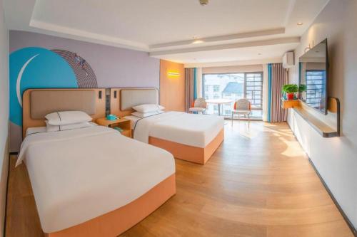 Postel nebo postele na pokoji v ubytování City Comfort Inn Hengyang Nanyue Scenic Spot Temple