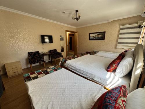 Postel nebo postele na pokoji v ubytování Hotel Ipekyolu