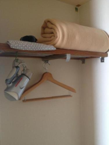 a shelf with a keyboard and a mouse on it at Marroad Inn Tokyo in Chofu