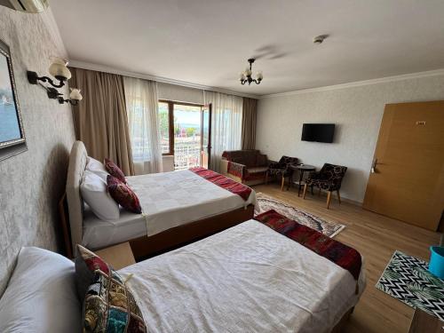 Postel nebo postele na pokoji v ubytování Hotel Ipekyolu