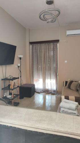 TV a/nebo společenská místnost v ubytování Apartman Dionis J