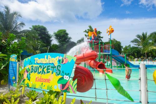a pool with a water park with a water slide at Astoria Palawan in Puerto Princesa City