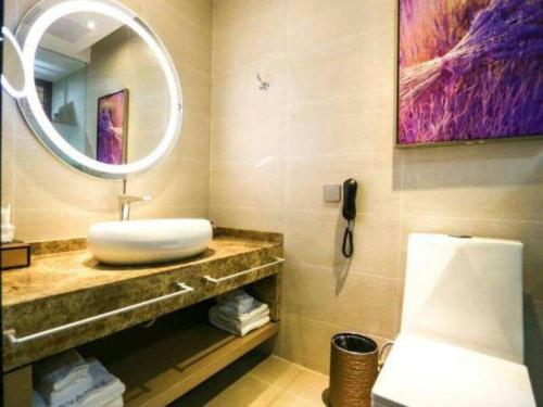 a bathroom with a sink and a mirror at Lavande Hotel Xi'an Longshouyuan Wenjing Road in Xi'an