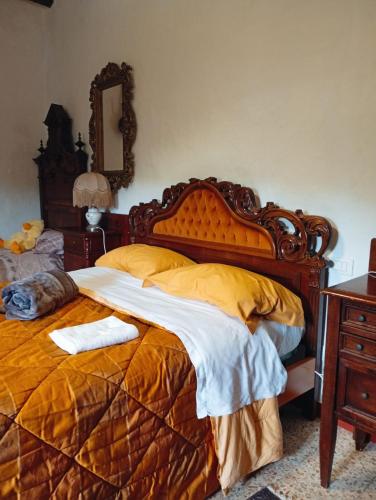 a bedroom with a bed with a cat laying on it at Casa del Falco in Vitorchiano