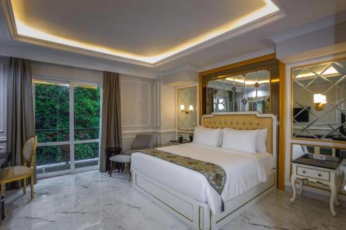 Ένα ή περισσότερα κρεβάτια σε δωμάτιο στο S&F Residence Kemang Jakarta