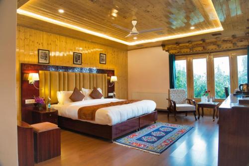 a bedroom with a large bed in a room at Hotel Royal Ladakh, Leh in Leh