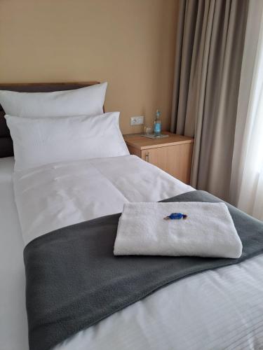 Ένα ή περισσότερα κρεβάτια σε δωμάτιο στο Hotel Rhin Inn