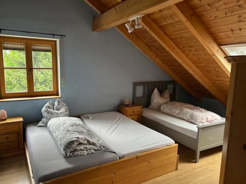 a bedroom with two beds in a attic at Unterkunft in Anzing - DG - 90 qm in Anzing