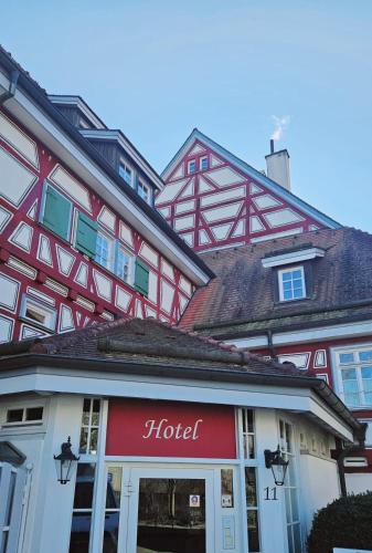 a hotel in front of a building at Altes Pfarrhaus Hotel und Restaurant in Bad Überkingen