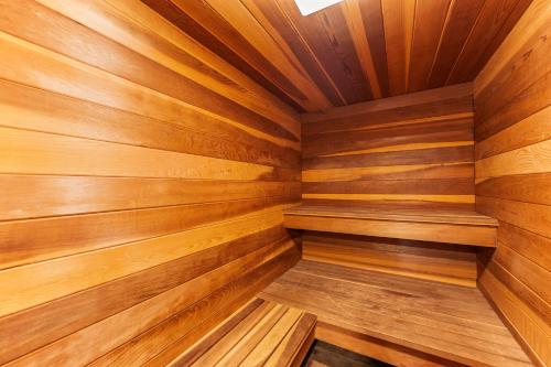 a sauna with wooden walls and ceiling at Rockridge 59 by Summit County Mountain Retreats in Breckenridge