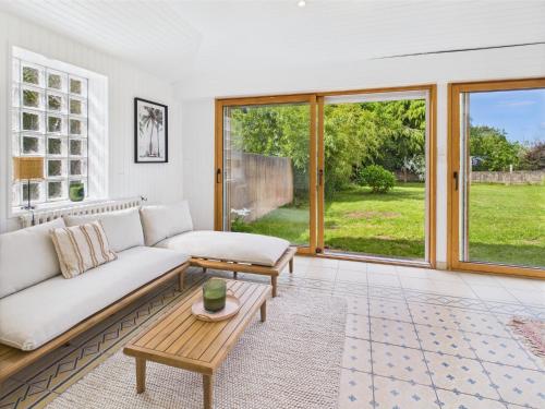 a living room with a couch and a table at -SUZANNE- Maison de charme au coeur de Nevez in Névez