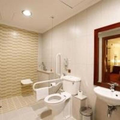 a bathroom with a toilet and a sink at Dancenter Luxury Holiday International Dubai in Dubai