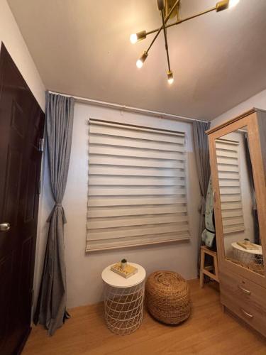 a bathroom with a window with a sink and a mirror at Korean Themed 1BR Staycation in Marilao Bulacan in Marilao