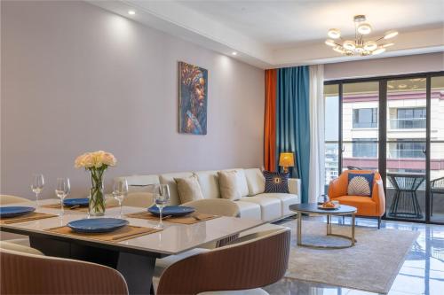 a living room with a table and a couch at Sunset Skyline Alba by YourHost1 bedroom Nairobi in Nairobi