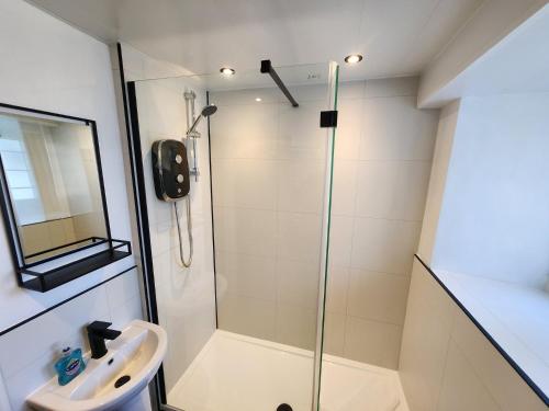 a bathroom with a shower and a sink at 1 Bed in Cartmel LCC15 in Cartmel