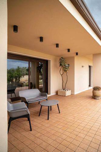 a living room with a couch and a table at Sammit holiday home in Michelica