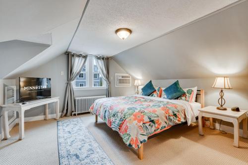 a bedroom with a bed and a tv in it at Edina Escape in Minneapolis