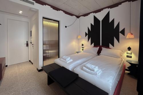 Postel nebo postele na pokoji v ubytování Bazaar Hotel