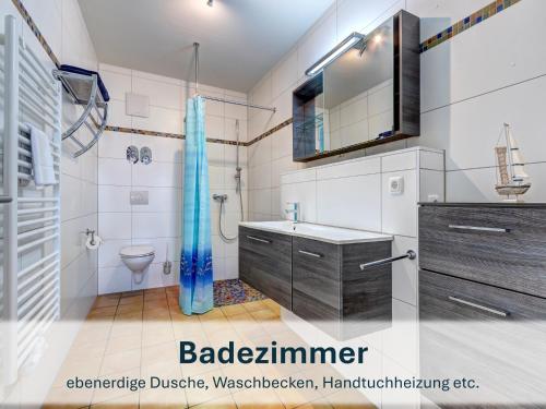 a bathroom with a shower toilet and a sink at Peenemünde, Seglerhafen_SB_Trimaran 4 WE in Peenemünde
