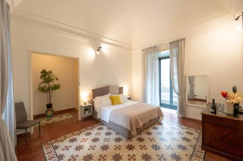 Voodi või voodid majutusasutuse Palazzo Bruca Catania toas