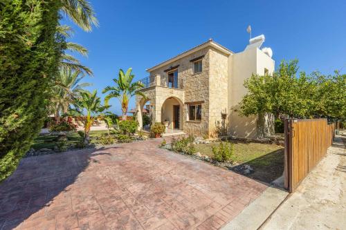 an image of a house with a driveway at Villa Agathi in Argaka