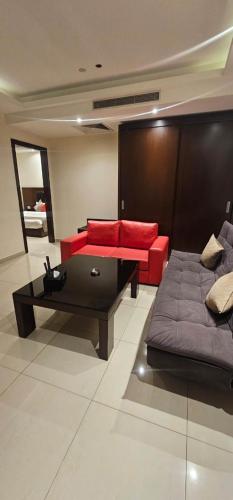 a living room with a couch and a coffee table at Jounieh Suites Boutique Hotel in Jounieh