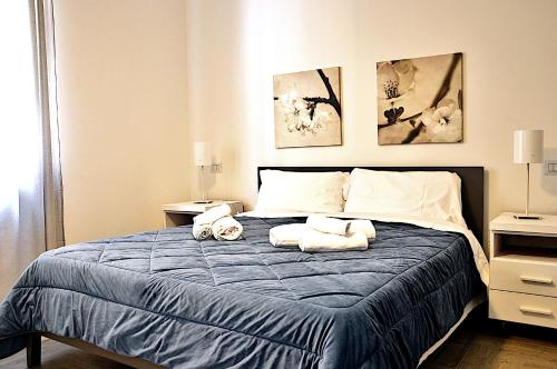 Ένα ή περισσότερα κρεβάτια σε δωμάτιο στο Italian Experience-Casa Alessia