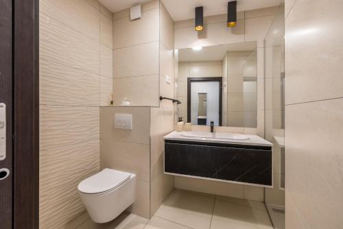a bathroom with a toilet and a sink and a mirror at Sea View Luxury Rooms Seven of Nine in Split
