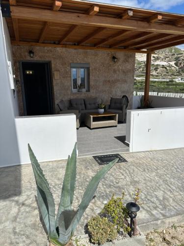 a patio of a house with a couch at Little House On The Prairie in Zefiría