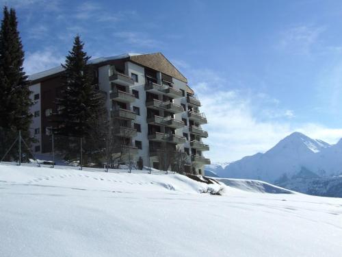 a building on top of a snow covered mountain at Casa La Foppa Füger in Sedrun