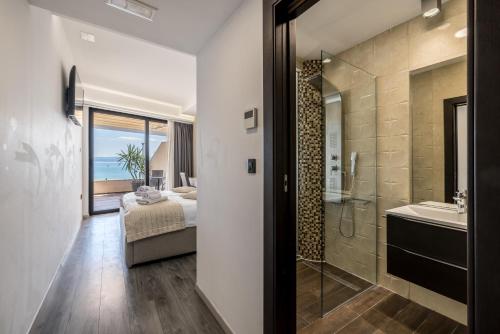 a bathroom with a bed and a shower and a sink at Sea View Luxury Rooms Seven of Nine in Split
