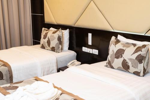 Ein Bett oder Betten in einem Zimmer der Unterkunft The Apo View Hotel