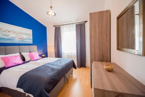 Ένα ή περισσότερα κρεβάτια σε δωμάτιο στο Apartments Portun