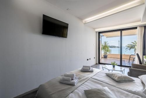 a bedroom with a large bed with a large window at Sea View Luxury Rooms Seven of Nine in Split