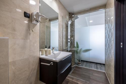 a bathroom with a sink and a shower at Sea View Luxury Rooms Seven of Nine in Split